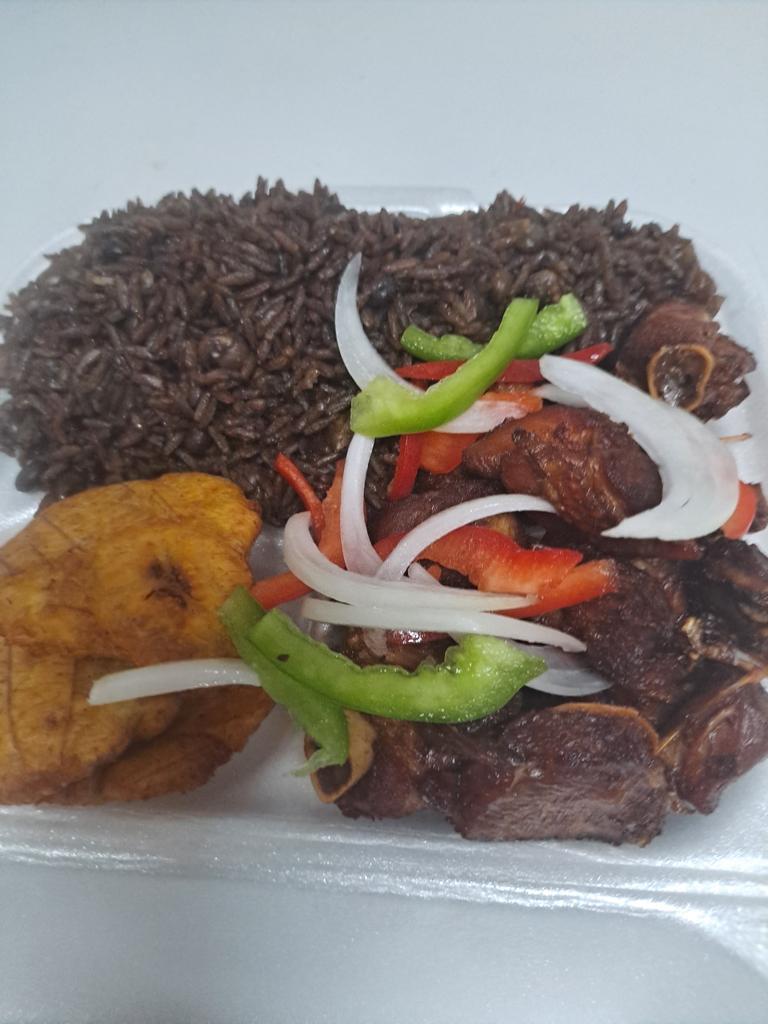 Tasso with diri djon djon and plantain